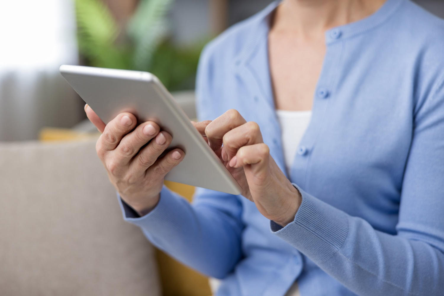 Physician holding a tablet with a patient chart