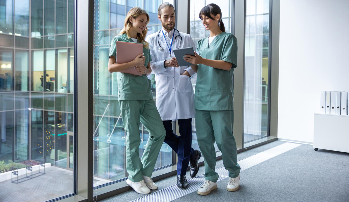 Hospital physician on rounds with a tablet
